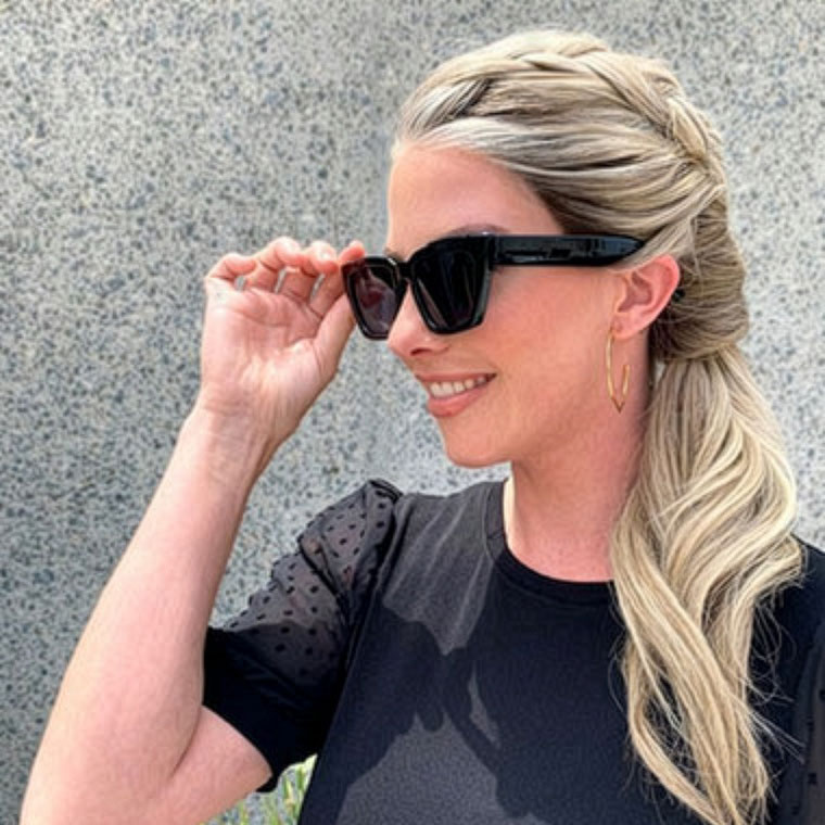 Woman wearing a wig styled in a french braid