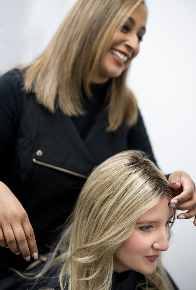 Woman getting a wig fitted