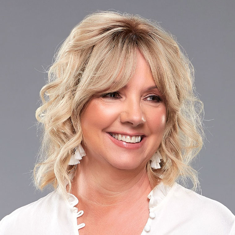 Smiling woman with a bonded hair topper