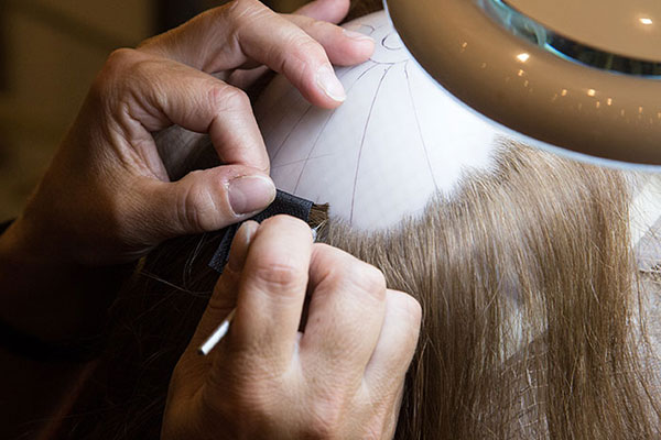 100% custom, human hair CNC prosthetic systems