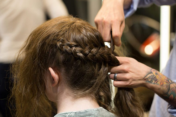 Woman having her hair styled